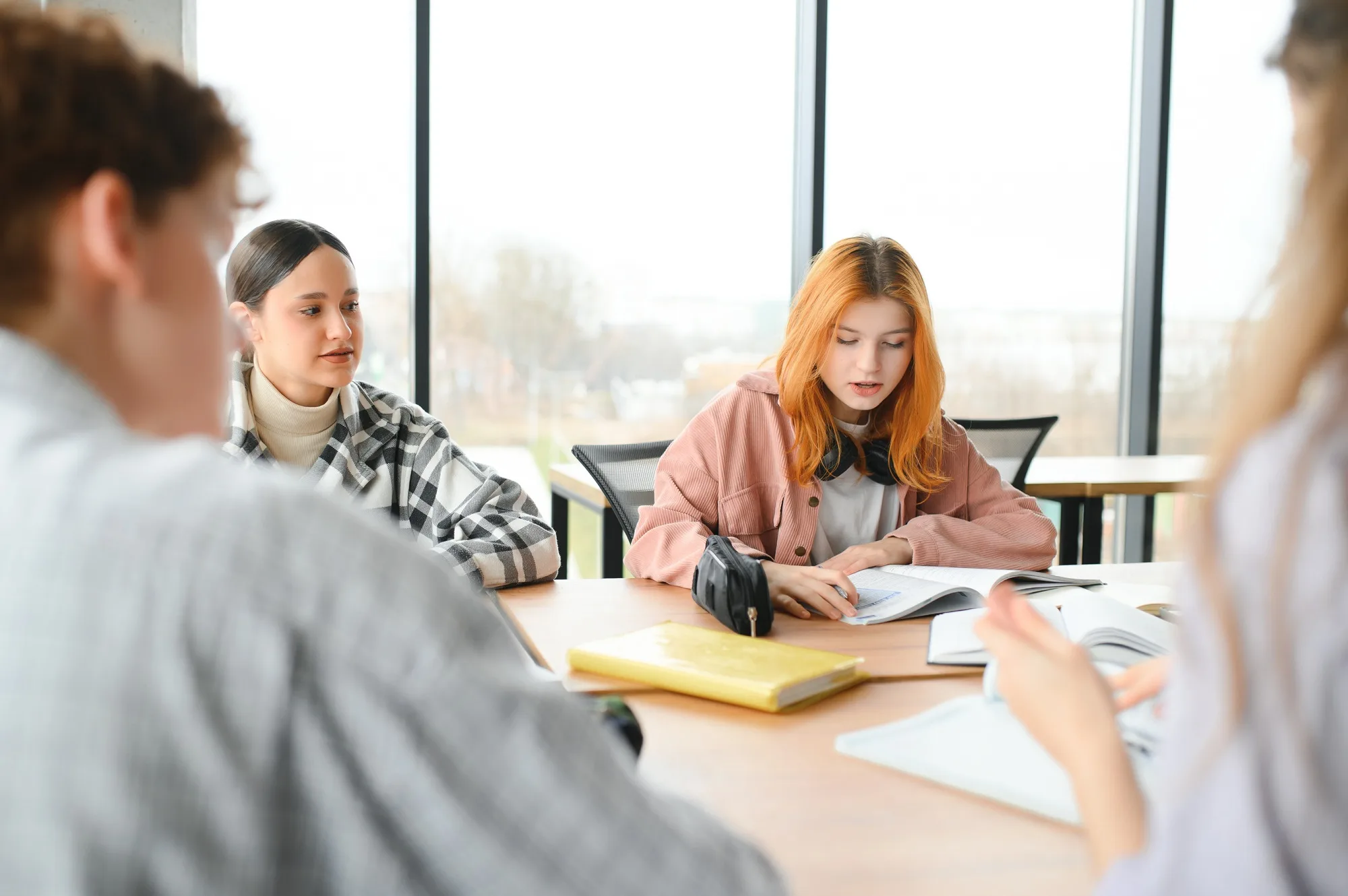 Happy high school students in the classroom